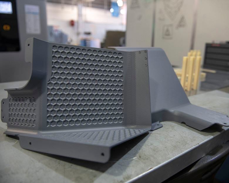  Latrine covers, the first aircraft parts authorized for use after being printed on the Stratasys F900 3D printer are on display Aug. 15, 2019, at Travis Air Force Base, Calif. [Image: U.S. Air Force photo by Louis Briscese] 
