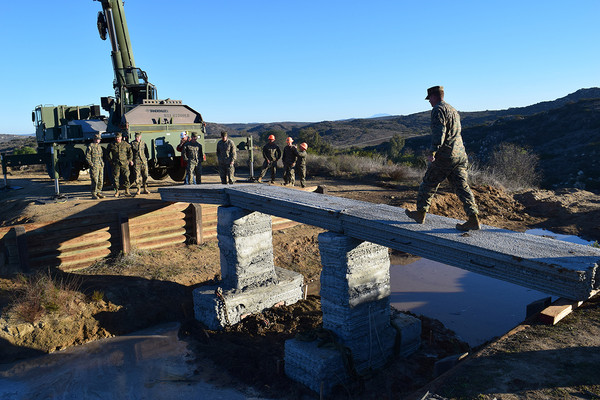  3D printed concrete footbridge created by United States Marines [Source:  Defense Logistics Agency ] 