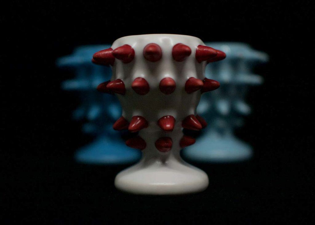  The Spike Cup, 3D printed in ceramic and with protrustions colored blood red with a white cup, done in a matte glaze [Image: Joy Complex] 