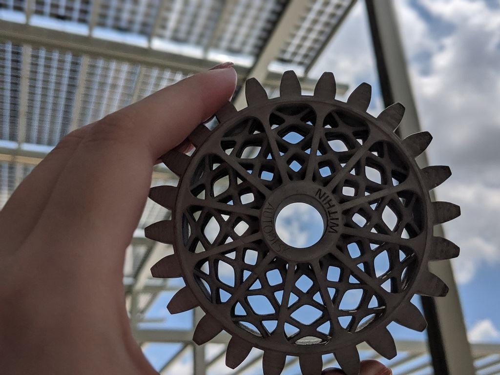  A Metal Jet 3D printed part soaks up the sun under the Center of Excellence’s photovoltaic roof [Image: Sarah Goehrke] 