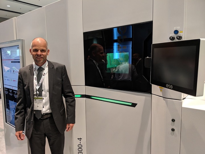  Dr. Adrian Keppler, CEO, EOS GmbH, with the new M300-4 at IMTS [Image: Fabbaloo] 