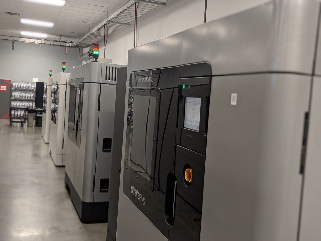  A row of Fortus 900mc 3D printers at work at Stratasys Direct Manufacturing in Belton, TX [Image: Fabbaloo] 