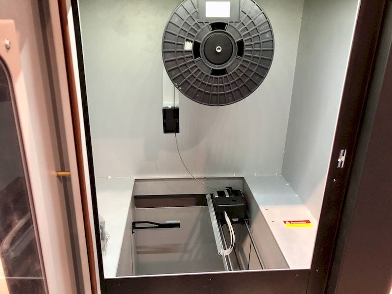  Inside the CoLiDo Metal 3D printer. Note the spool is held inside the build chamber 