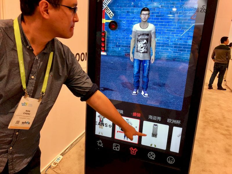  A virtual reality clothing simulation kiosk by ESUN Display 