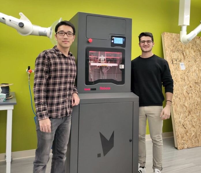  Penn State researchers beside their new high temperature 3D printer [Source: ROBOZE] 