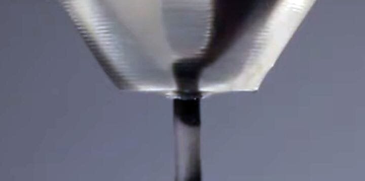  Detail of a MM3D material switching nozzle with two channels reaching the tip [Source: YouTube] 