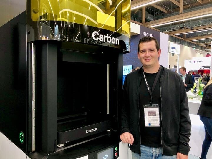  Carbon’s Philip DeSimone beside the Carbon L1 3D printer [Source: Fabbaloo] 
