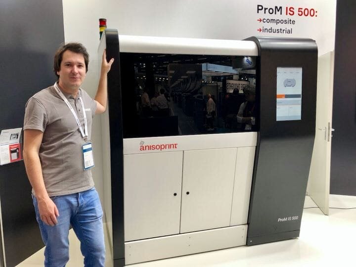  Anisoprint CEO Fedor Antonov beside the new ProM IS 500 high temperature continuous carbon fiber 3D printer [Source: Fabbaloo] 