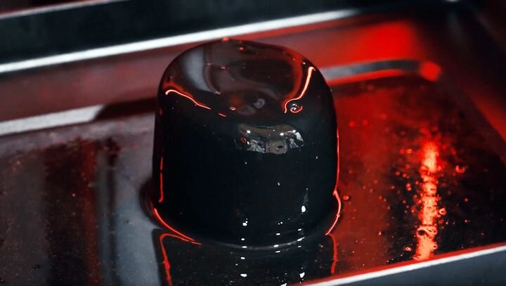  A solid block of resin apparently melting in an Origin 3D printer [Source: Origin] 