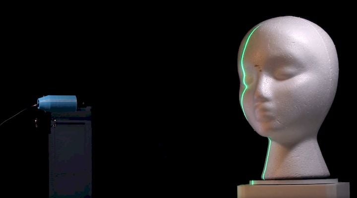  The Phiz 3D scanner lighting up an object with its laser [Source: KIRI Innovation] 
