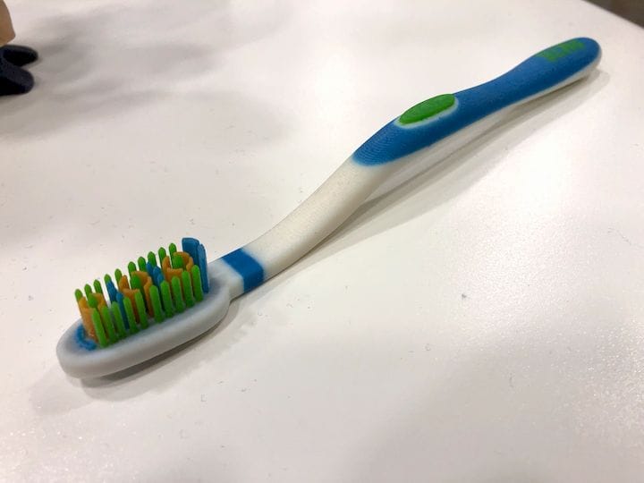  A color 3D printed toothbrush, made on a Stratasys J750. The bristles are rigid, not soft, though the J750 can print with flexible materials [Source: Fabbaloo] 