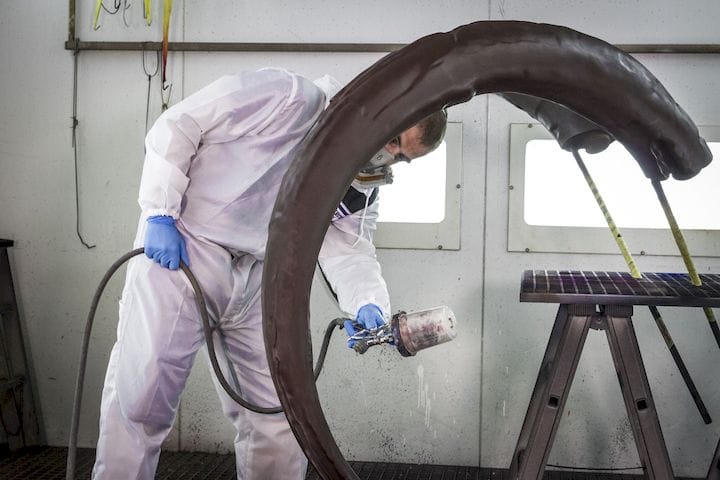  Painting a 3D printed Woolly Mammoth tusk [Source: i.materialise] 