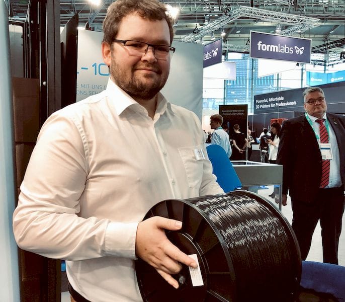  EVO-TECH’s Markus Kaltenbrunner holding a heavy 10kg spool of 3D printer filament [Source: Fabbaloo] 