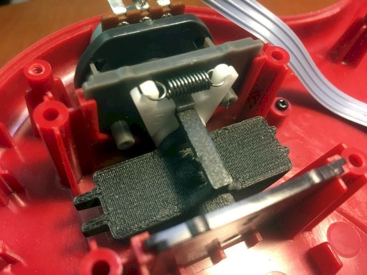  The 3D printed repair part installed in the aging Guitar Hero [Source: SOLIDWORKS] 