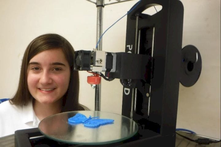  Karbowski posing with one of her creations and the printer that was used to create it. (Image courtesy of See3D’s GoFundMe page, which is accessible  here .) 