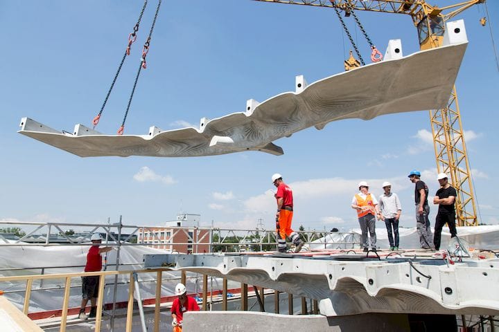  Lifting one of the Smart Slabs into position [Source: Dezeen] 