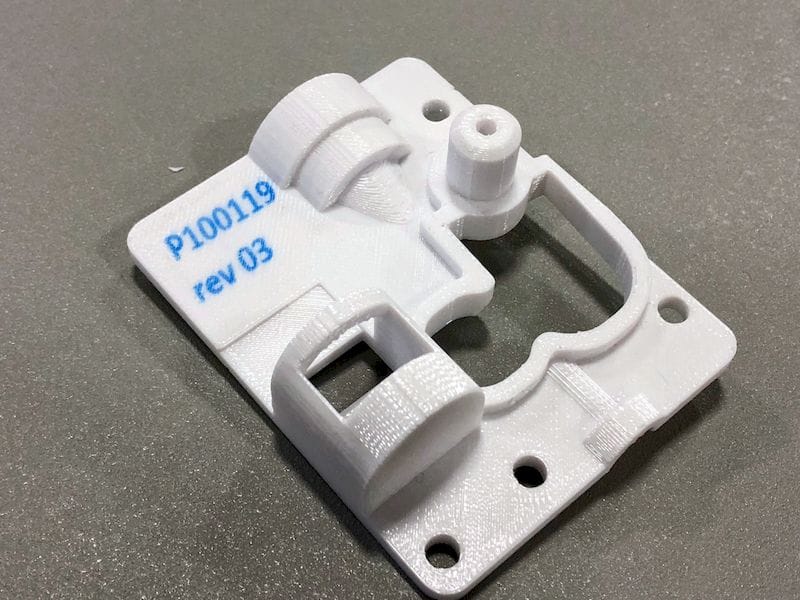  A part 3D printed by Rize with automatically embedded part and version numbers 