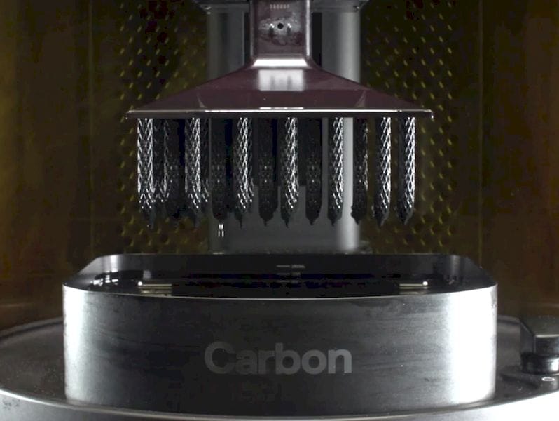  A Carbon 3D printer producing some programmable objects 
