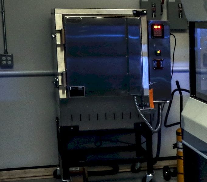  In the background could this be GE Additive's sintering furnace for their new H1 concept?  
