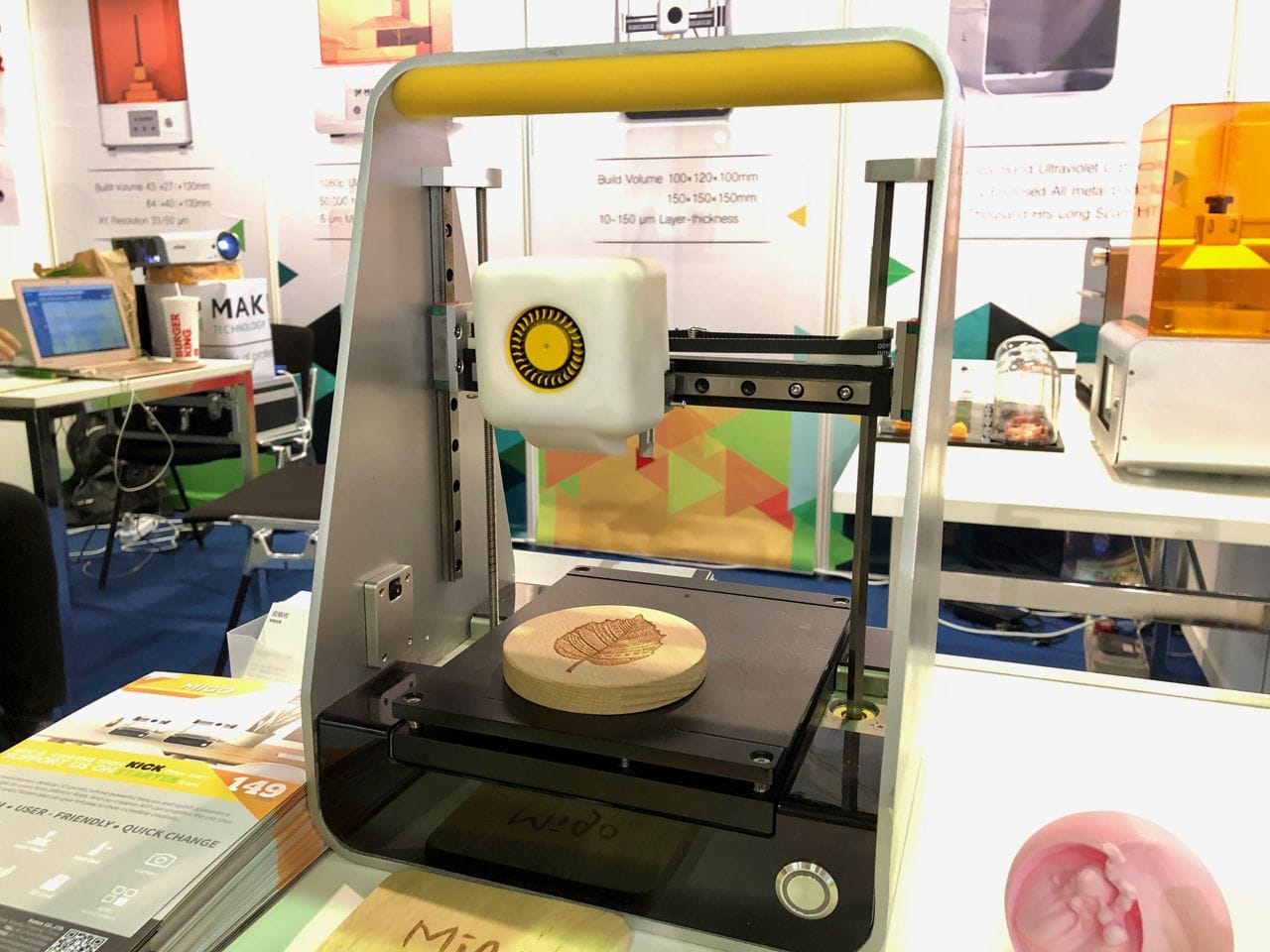  The MakeX Migo L portable desktop 3D printer, showing a laser engraved wood piece 