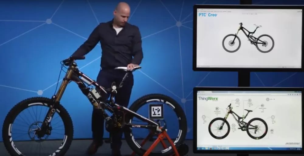  In what may represent the state of the art for digital twins in design engineering, a Santa Cruz road bike is shown at PTC's annual user meeting, ThingWorx 2017. Movement of the real bike is reflected in the digital twin, as well as its activity (speed, RPM, etc.). (Image courtesy of PTC on YouTube.) 