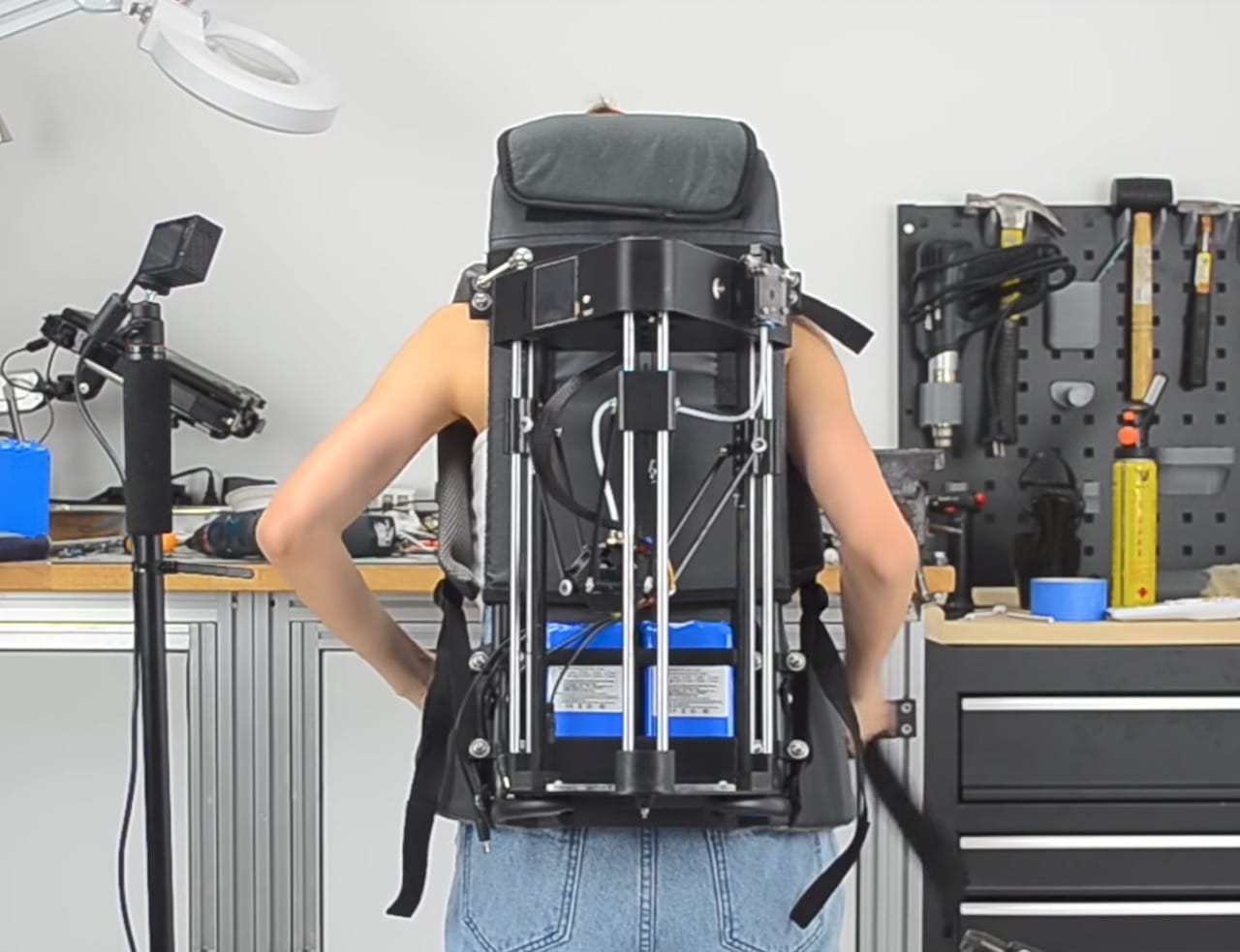  The 3D printer is literally mounted on Naomi Wu's back 