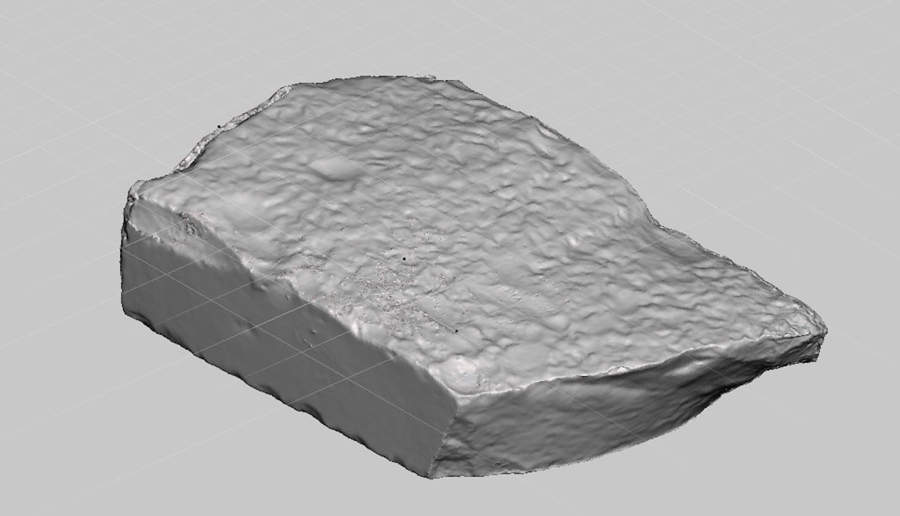  The back side of the Rosetta Stone 3D model, showing a rough, rocky surface 