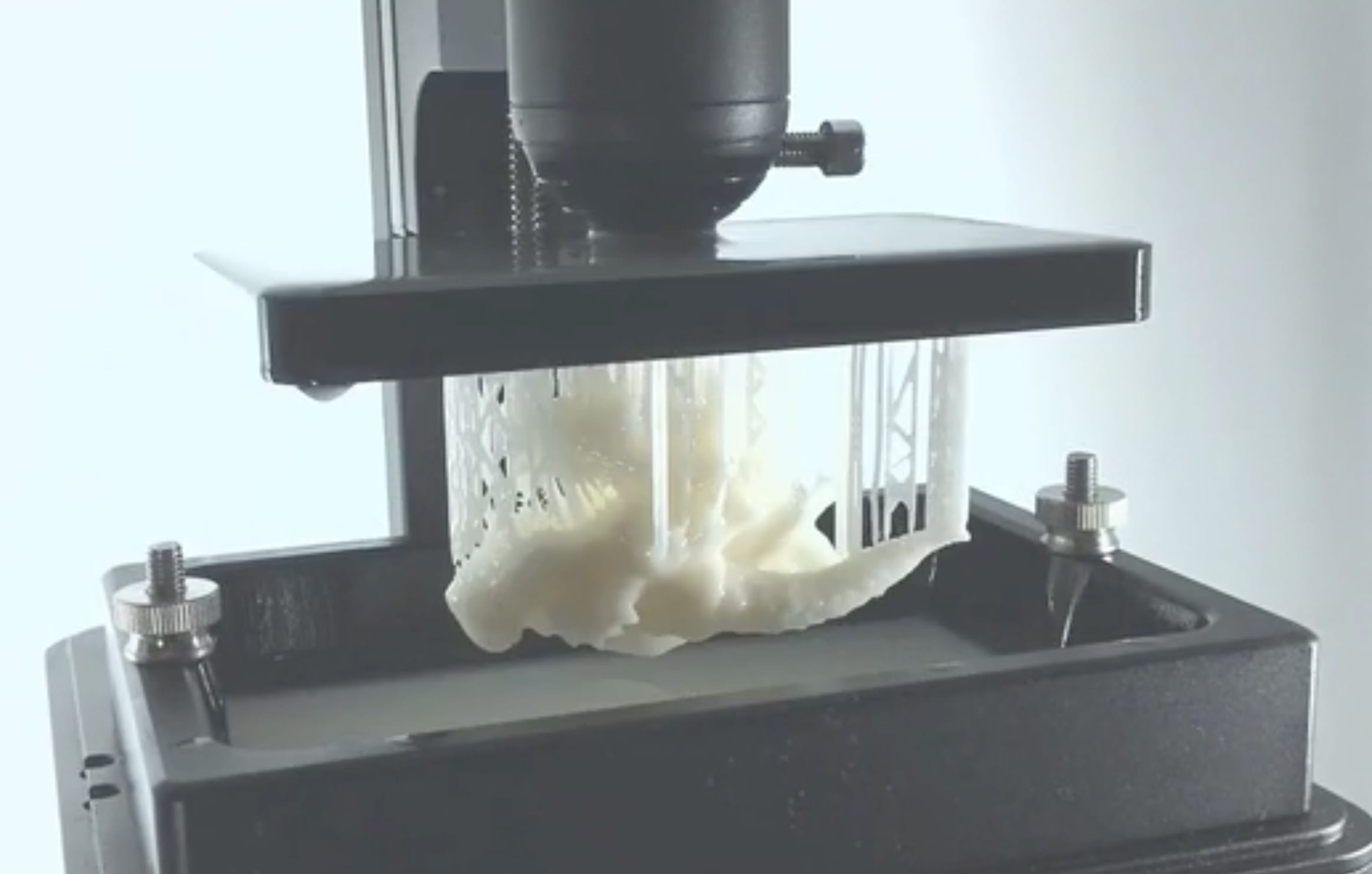  The D2K Insight desktop 3D printer completing a print job 
