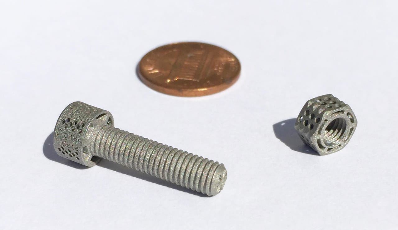  Tiny 3D printed metal nut and bolt of exceptionally low weight due to 3D design 