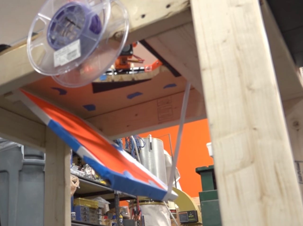  The open trap door allows the 3D print to fall into a bin below the printer 