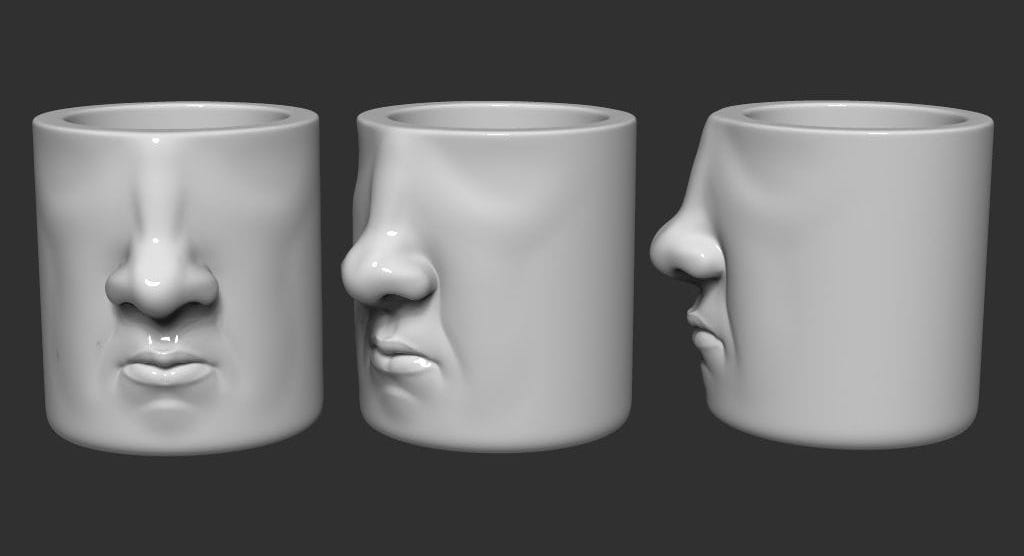  Three views of the 3D printed Face Mug 