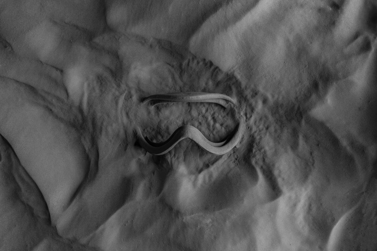  3D printed ski goggles on the new Formlabs Fuse 1 showing how the final object is embedded in a powder bed 