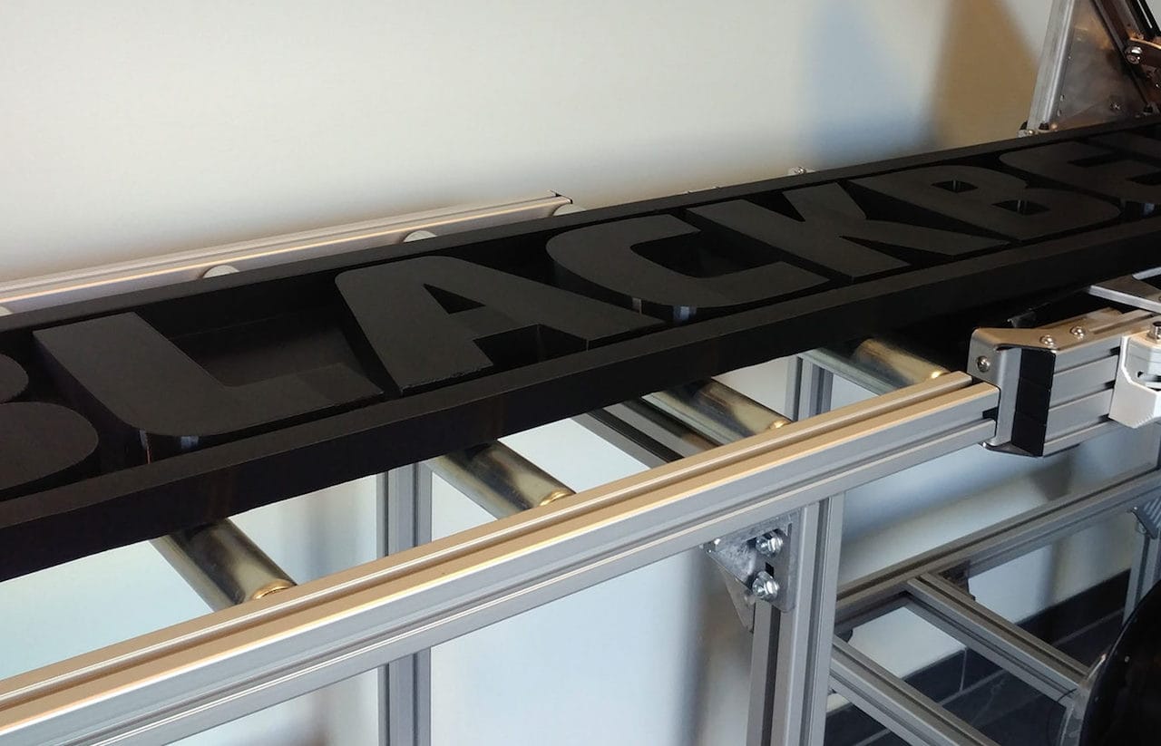 A rather lengthy 3D printed sign coming off the Blackbelt 3D printer 