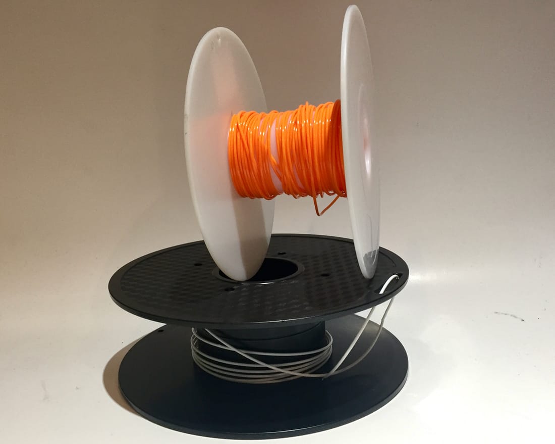  3D printer spools with not a lot of filament left on them 