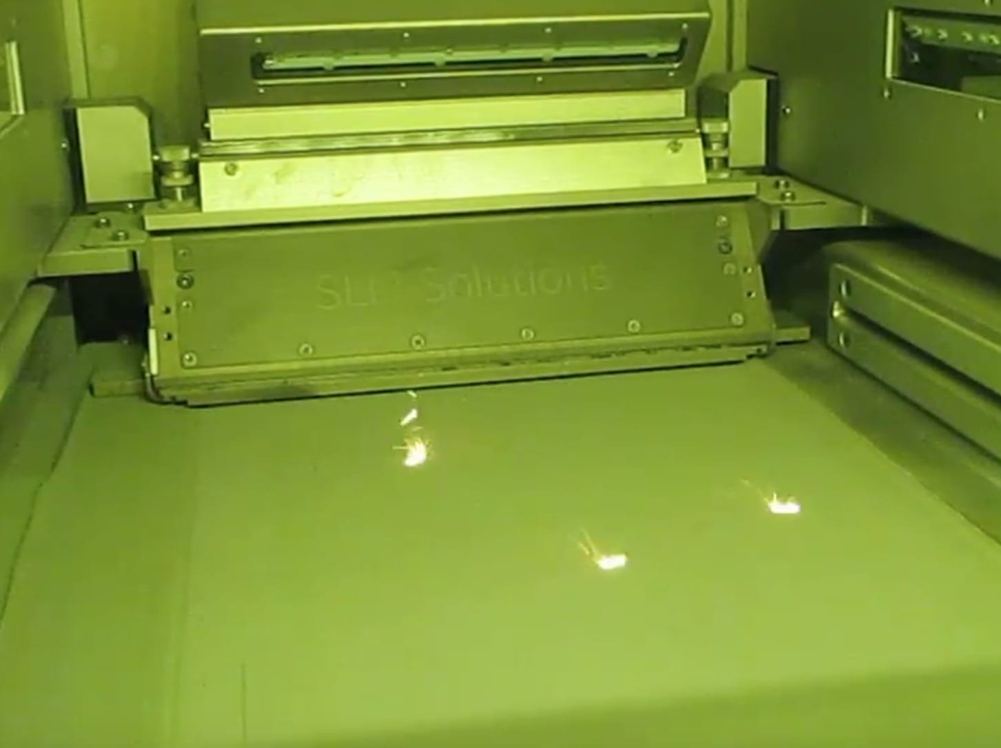  A laser system 3D printing in metal powder with hopefully little oxygen present 