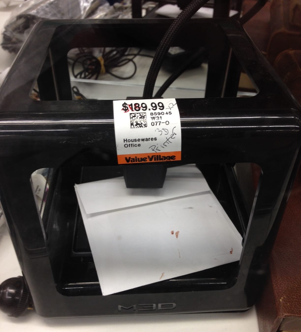  The whole view of the bargain 3D printer, which appears to be a M3D Micro 