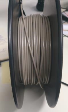  A spool of PEEK plastic filament produced by 3devo 