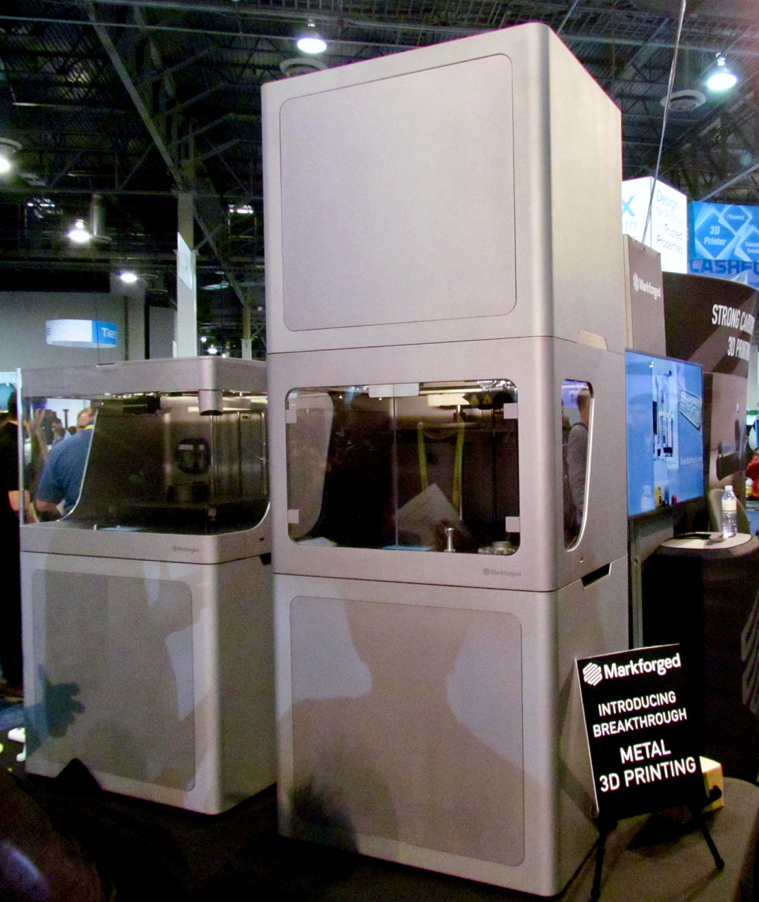  The Markforged Metal X (on the right) 3D metal printer, beside one of its non-metal siblings 