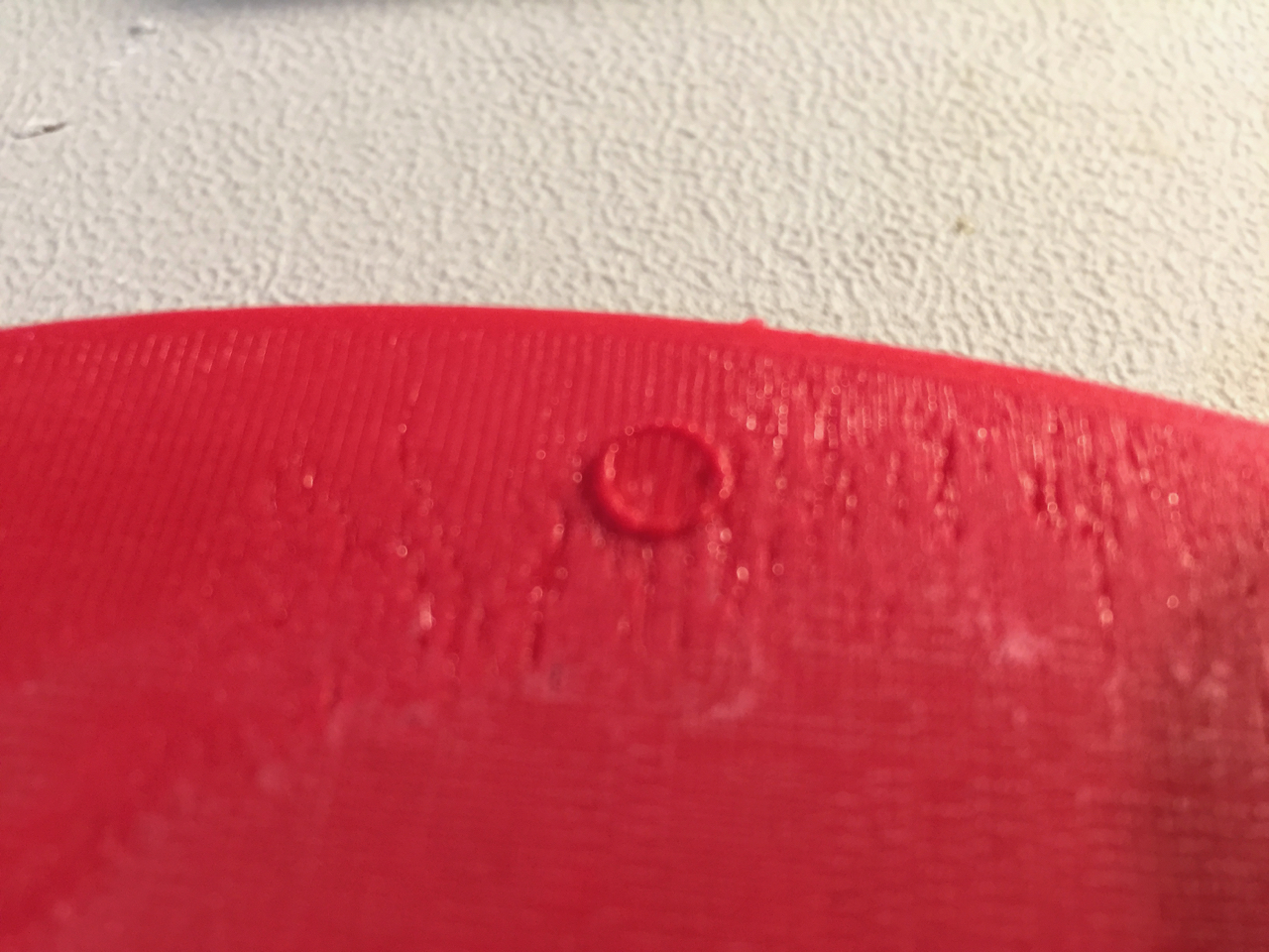  If 3D printing raftless overtop of the build plate buttons, you get an effect like this 