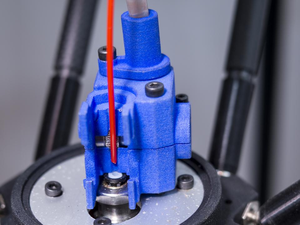  Inserting a filament into the Zesty Nimble 3D printer extruder - just drop it into the hot end and close 