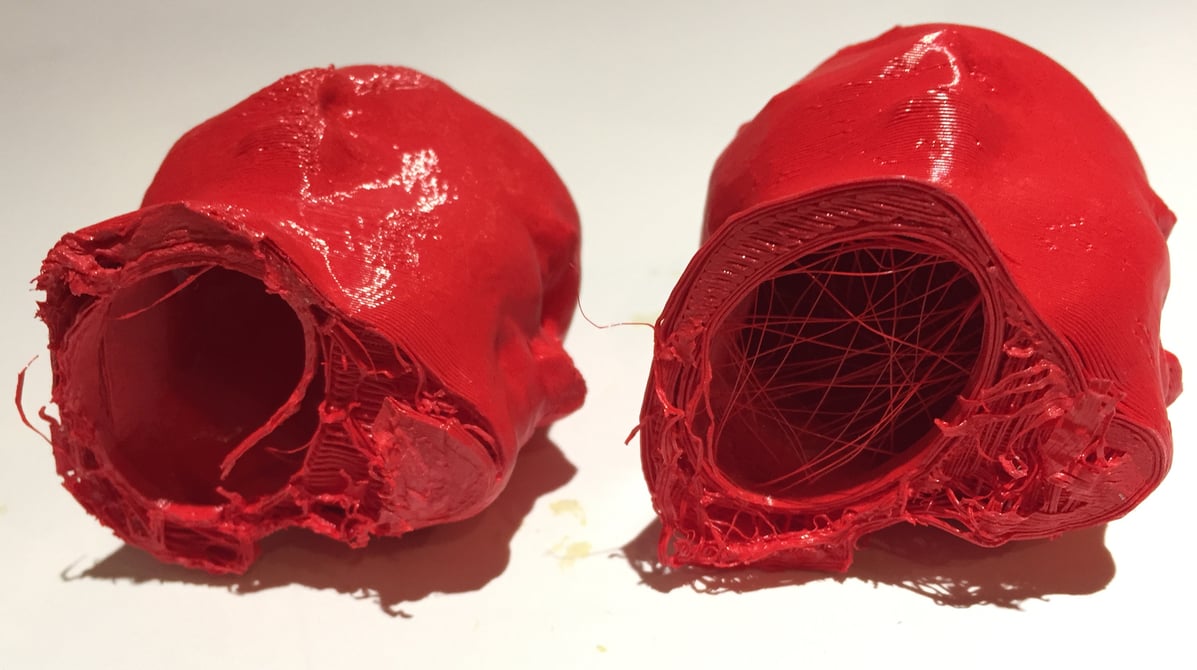  Two 3D printed Robert heads decapitated due to extreme bed adhesion 