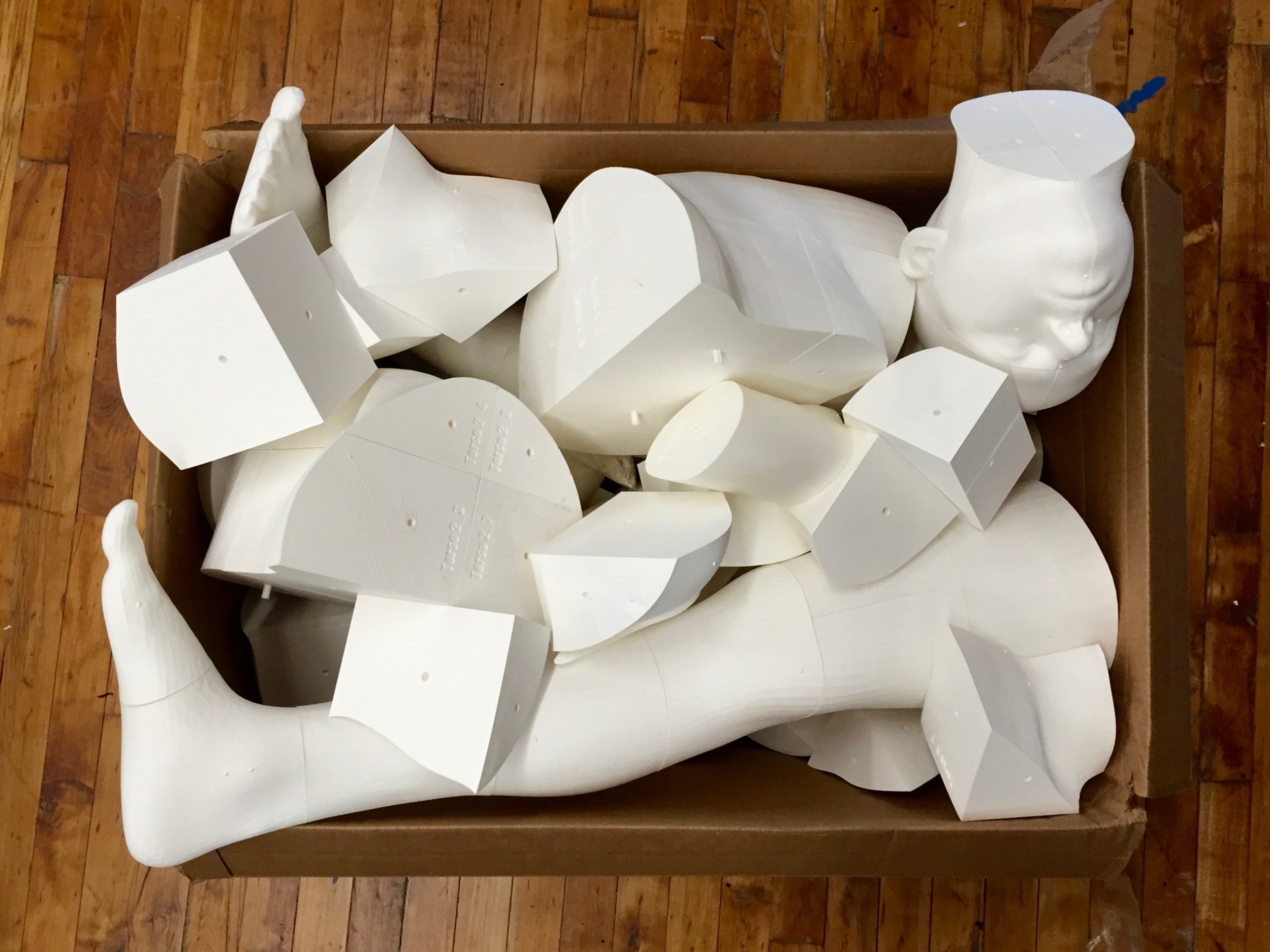  A collection of unassembled 3D printed body components 