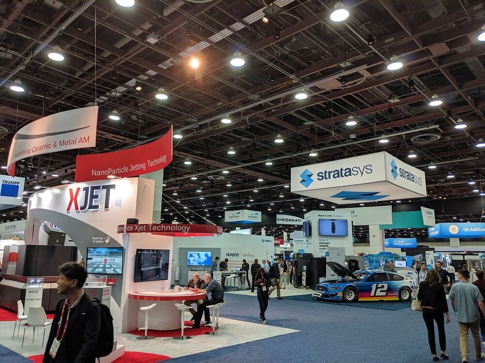 Not to be replicated this year; a glance at the busy floor of RAPID + TCT 2019 [Image: Fabbaloo]