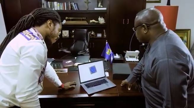  Discussing data over a 3D model in President Bio’s office [Image: YouTube] 