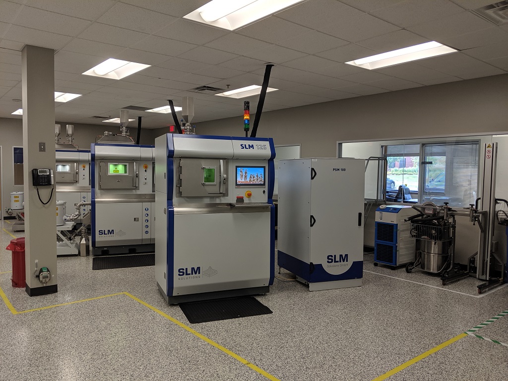 SLM Solutions machines and powder sieving stations set up in Wixom, MI [Image: Fabbaloo] 