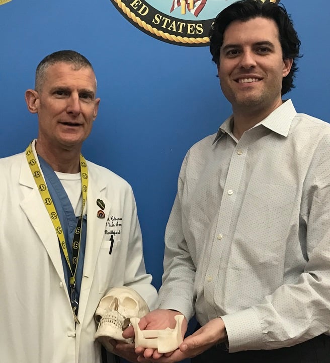  VA Puget Sound Health Care System Maxillofacial Surgeons James Closmann (left) and Jeffrey Houlton are taking the search for a perfect fit for their patients to the next level by harnessing the power of 3D printing to deliver adapted mandibular implants [Image via Stratasys] 